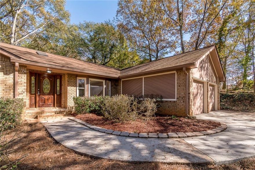 Hard-to-Find One-Level Ranch in Lawrenceville! They don’t build them like this anymore! This beautifully redesigned and fully remodeled ranch offers spacious one-level living in the highly sought-after Brookwood High School district. With 3 bedrooms, 2 baths, and a comfortable master-on-main layout, this home is move-in ready and perfect for families of all stages. Step inside to find a bright, open floor plan featuring original hardwood floors in the main living area, new flooring in the kitchen, baths, and bedrooms, and a fresh, modern look throughout. The kitchen has been updated with stunning quartz countertops and brand-new stainless steel appliances—ideal for easy meal prep and family gatherings. Enjoy extra space in the separate dining room and relax year-round in the sunroom overlooking the private, park-like backyard. The completely redesigned master suite feels like a retreat, featuring his-and-hers closets, a luxurious new bathroom with a large tile shower, soaking tub, and a stylish new double vanity. Need extra storage or workshop space? The partial unfinished basement offers endless possibilities. With NO HOA, you’ll enjoy the freedom to make this home truly yours.