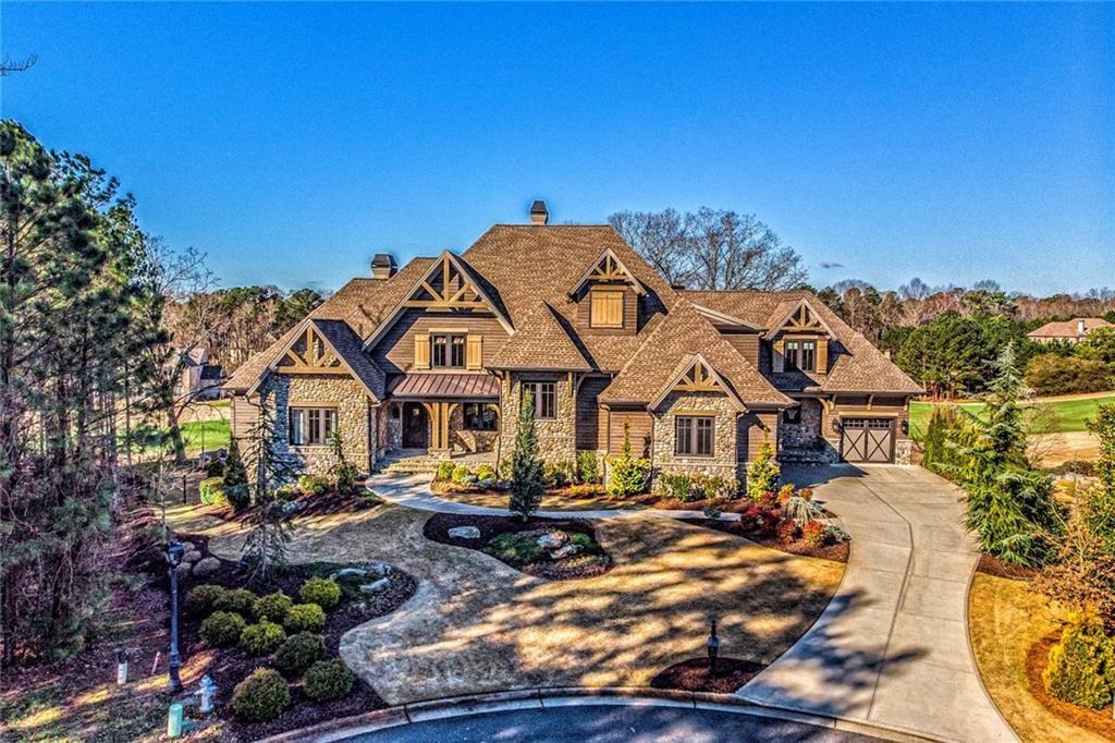Custom new construction opportunity on Lot 18 in beautiful Echelon in Alpharetta with Anker Custom Homes. Home will be appx. 6,000 sq ft (above grade) on an unfinished Terrace level, and will be built on a gorgeous 1+ acre lot adjoining green space for privacy. The welcoming facade boasts covered entrance with double door entry set against painted brick or stone. The warm entry opens to a gallery that is open to the fireside lodge room, dining room, chefs kitchen and family room. The dining room and lodge room are well suited for entertaining with serving bar area and wine cellar. Kitchen will feature custom cabinetry with quartz countertops as well as top quality stainless steel appliances. The family room will blend seamless to the covered veranda for outside entertaining and possible pool (not included). This unique plan boasts both luxurious owners suite and guest bedroom on main. This home can be handicap accessible if needed. Second floor features 4 generous bedrooms complete with private baths. Terrace level is pre-planned and can be finished as you wish. Please check out the virtual tour link to tour this home...