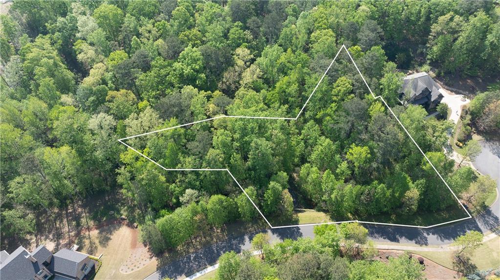 Exceptional opportunity in Anderson Farm, just minutes from Kennesaw Mountain’s scenic trails, biking paths, and recreational amenities. Build your dream home in the highly sought-after Anderson Farm community. This tranquil, park-like lot features a picturesque stream and offers a serene setting ideal for your custom home vision. Included in the listing documents are three different plats, one of which clearly outlines the buildable area. This lot is adjacent to 310 Anders Path, a stunning custom home also currently available for sale. Located just a couple of miles from the vibrant and charming Marietta Square, Anderson Farm is a well-established community known for its beauty, privacy, and architectural integrity. For those seeking additional space or investment potential, there is a rare opportunity to purchase 306, 310 and 314 Anders Path - all under the same ownership. Architectural controls and neighborhood covenants help preserve the community’s character. Copies of the covenants are available upon request.