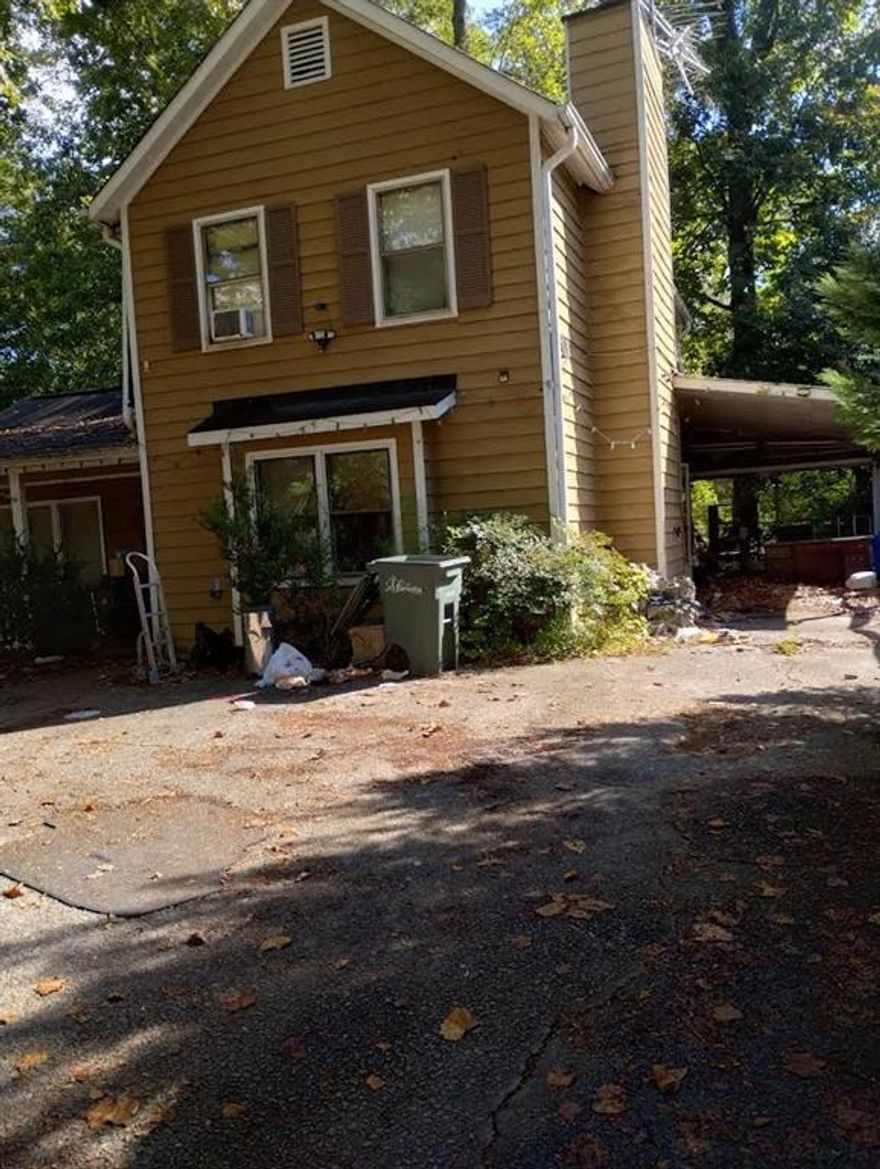 This move-in ready home is waiting for its next owner. It has solid bones and plenty of potential for someone to make it their own. The property features a carport and an enclosed porch, offering extra space to enjoy. Conveniently located less than 10 minutes from Marietta Square, you’ll enjoy easy access to local shops, dining, parks, and top-rated schools. Don’t miss out on this well-located home with so much to offer!