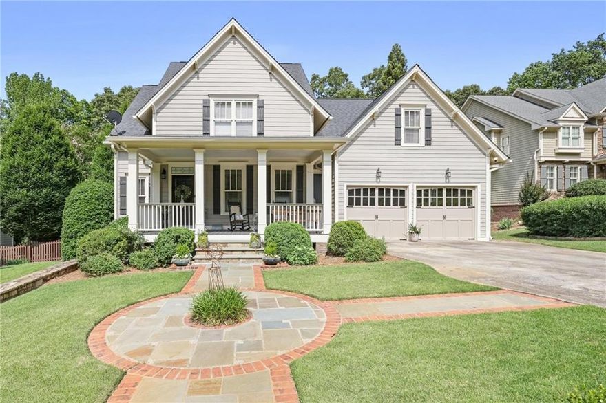 Luxury Living Meets Thoughtful Design in Marietta’s Premier Location

Tucked away in a peaceful cul-de-sac just minutes from both the vibrant energy of Marietta Square and the tranquil trails of Kennesaw Mountain, this custom-built, beautifully appointed home offers the perfect blend of luxury, comfort, and convenience. Designed with entertaining and relaxation in mind, this property is a true retreat—indoors and out.

A wide rocking-chair front porch welcomes you into the main level, where 9-foot ceilings, abundant natural light, and gleaming hardwood floors create an inviting, open atmosphere. The formal dining room flows seamlessly into a spacious living area, kitchen, and breakfast room—ideal for gatherings large or small.

The kitchen is both stylish and highly functional, featuring custom cabinetry, Carrara marble countertops, a massive island with leathered black granite, and a complementary walnut butcher block breakfast bar. High-end appliances include double ovens and a gas cooktop. The adjacent family room centers around a beautiful stone gas-log fireplace, offering a warm and welcoming space to relax.

Step through to the showstopping screened porch, complete with wood-look tile, a coffered ceiling, and a wood-burning fireplace—perfect for year-round enjoyment. Just beyond, the connected deck features Brazilian Ipe wood flooring and a built-in Viking gas grill, all overlooking a meticulously landscaped backyard with stone pathways and a custom firepit area.

The main-floor primary suite is a peaceful retreat, featuring a large custom walk-in closet and a spa-inspired ensuite bath with heated Carrara marble floors, a luxurious soaking tub, an oversized walk-in shower, and dual vanities.

Upstairs, you’ll find three generously sized bedrooms with large closets, two full bathrooms, and a spacious bonus room ideal for a playroom, media room, or office.

The finished terrace level is a standout, offering hardwood and polished concrete floors, a full kitchen, a steam shower bath, a home gym, a great room, and a flexible space perfect for a guest suite or office. The basement opens onto a slate patio and the fully fenced backyard—your own private oasis.

Additional features include a two-car garage and a large driveway that provides ample parking for guests.

This exceptional home combines timeless elegance with everyday practicality in one of Marietta’s most desirable locations. A rare find—schedule your private showing today.
