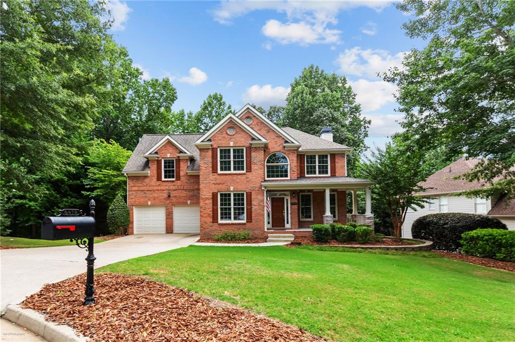Welcome to this stunning home in the highly desirable Laurel Park community of Sugar Hill! Boasting three stories of optimal living space, this home is thoughtfully designed for both everyday comfort and effortless entertaining. The main level features a beautiful living room with a cozy fireplace, custom built-ins, and an abundance of natural light. The beautiful, oversized kitchen features tons of storage and counter space —perfect for hosting or day-to-day living. Step outside to a screened-in porch, perfect for enjoying all four seasons. Upstairs, you’ll find four spacious bedrooms and two full bathrooms. The generously appointed primary suite features dual vanities, a soaking tub, and a beautiful, tiled shower, offering a serene retreat at the end of the day. The finished basement offers additional flexible space and opens to a terrace-level patio overlooking the private, landscaped backyard. Located just minutes from top-rated schools, shopping, dining, and Lake Lanier, this home checks every box—space, style, and an unbeatable location.