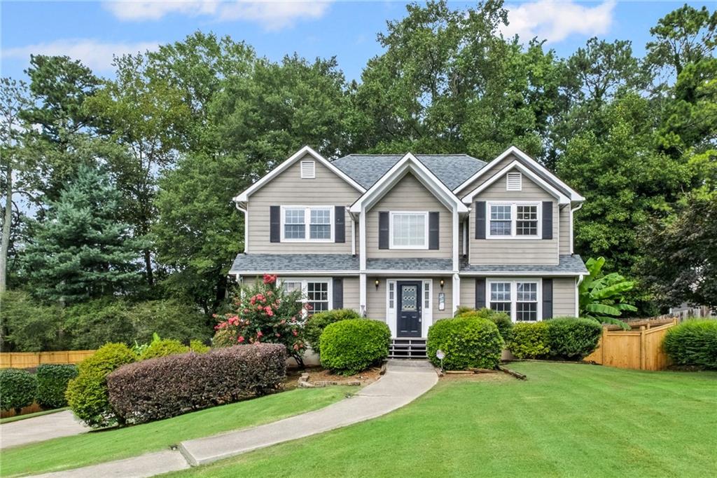 Move in tomorrow! East Cobb charming traditional home on a level lot. This is a great value, so much living space, wide plank bamboo flooring, no carpeting, and a sunlight finished basement. Granite kitchen with stainless appliances with a view to the fireside family room. A covered porch opens to large deck and fenced yard. The finished terrace level includes a media room with a dry bar and a spacious sun filled recreation room. Each adult must apply at https://apply.link/vNqQJLg