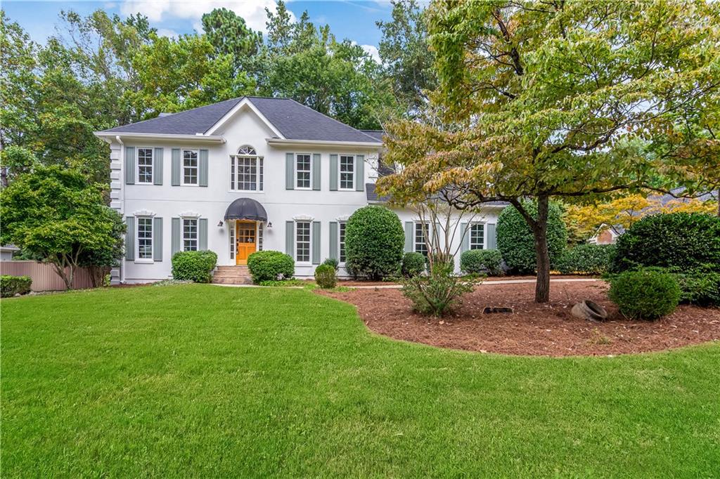 Welcome to 978 Denmeade Walk, a home that blends timeless design with modern comfort in one of Marietta's most sought-after neighborhoods. Featuring 4 bedrooms and 2.5 bathrooms, this sun-drenched residence is wrapped in engineered hardwood floors and designed to inspire both everyday living and effortless entertaining. At the heart of the home, the designer kitchen offers abundant cabinet space, premium finishes, quartz countertops and a seamless connection to the living room, where stunning white oak beams create warmth and architectural charm. Expansive windows frame each space, filling the home with natural light. The primary suite is a retreat of its own—featuring a spacious sitting room, his-and-her closets and vanities, designer tile details, and a soaking tub overlooking the private backyard. Secondary bedrooms are generously sized, making this home as functional as it is stylish. For peace of mind: a brand new roof, new windows, and a newer HVAC system all add to its long-term value. Outdoors, enjoy a flat, usable backyard with a brand new deck—perfect for morning coffee, weekend barbecues, or gatherings with friends and family. Set within an established and highly sought-after community, 978 Denmeade Walk offers not just a house, but a lifestyle of comfort, style, and connection.