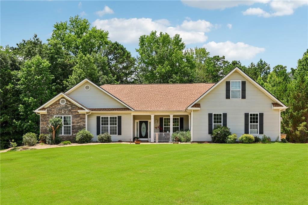 INTEREST RATES MATTER! LENDER IS OFFERING A 1 YEAR RATE BUY DOWN! PRICE ADJUSTMENT & THE POOLS READY! Welcome to your dream Southern sanctuary-a timeless ranch plan that blends elegance, space, & comfort in every detail. Minutes from the Union Grove Schools, Shopping, Hospital & I-75! This beautifully designed living space of this 4bR/2BTH home (Plus bonus room) offers Vaulted ceilings in the Great Room with a fireplace, a main-level ensuite bedroom & exquisite craftsmanship throughout. The formal dining room, accented by a double tray ceiling that flows into a chef's kitchen featuring updated cabinetry, beautiful granite counters, tile backsplash, & island with lots of space. The spacious master suite is a true retreat, complete with a luxurious bath, double vanities, soaking tub, walk-in shower plus a large walk-in closet. A great feature on the Secondary bedrooms, 2 of the bedrooms have been joined to make a great in-law or teen suite and the adjoining bath that is fully handicap accessible with a great tiled roll in shower! The bedroom's can easily be converted back to two separate rooms, plus you have an additional bedroom, all on the main level! Upstairs features a versatile bonus room offering a cozy and private retreat. This flexible area is perfect for guests, a home office, hobby room, or a quiet sleeping space-making it a valuable extension of the home's living area. Additional highlights include an oversized 2-car garage, plus a functional mud/laundry room area. The beautifully manicured fenced backyard w/beautiful zero entry Inground pool made to be able to roll in a wheel chair, plus a firepit and patio area is ideal for relaxing or entertaining, HVAC is only a few years old & hardwoods/tile in living & dining, kitchen areas of the home plus many upgrades. This is beautiful home on a great quiet cul-de-sac lot that is more than a house; it's a Southern masterpiece designed for gracious living & unforgettable memories to be made! Sellers in the process of packing so Home will be Ready to Move-in! 1-Year Rate Buydown Available! Our preferred lender is offering a 1-year temporary buydown for this property. This program will lower your monthly payments by a full percentage point for the first year. Ask for all the details !