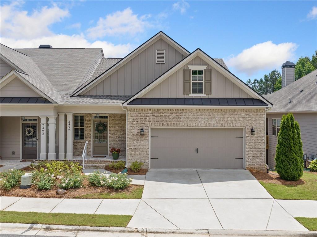 Welcome to this stunning home in Barrett Preserve in West Cobb! Perfectly situated in a sought-after location, this light and bright residence features a spacious open floor plan ideal for comfortable living. The large great room is a true centerpiece, showcasing a beautiful marble fireplace and seamless flow into the gourmet kitchen—a chef’s dream with quartz countertops, tiled backsplash, abundant white cabinetry, stainless steel appliances, and a massive island with breakfast bar seating. The spacious primary suite is conveniently located on the main level and offers a luxurious en suite bath complete with dual vanities, a walk-in shower, and a generous walk-in closet. Also on the main level, you’ll find a dining room, a laundry room and a half bath for guests. The finished terrace level provides versatile living space, including a large second family room, two oversized secondary bedrooms with a shared Jack and Jill bath, abundant storage, and a private patio overlooking the beautifully landscaped backyard—perfect for quiet relaxation.This home features a fresh, neutral color palette and truly shows like a new home. Roof less than a year old. It’s move-in ready and available for a quick close. Refrigerator, washer, and dryer remain! Don’t miss your opportunity to own this exceptional home in Barrett Preserve! Enjoy the Community's Covered Pavilion with large double-sided Stone fireplace and 2 sitting areas to gather with friends and neighbors. Barrett Preserve is a 55+ Active Adult Community with 20% of homes qualifying for any Age Ownership.