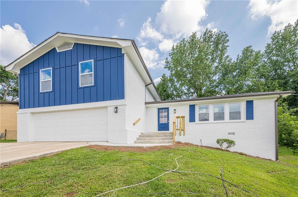 Fully Renovated Home with 4 Bedrooms & 3 Full Baths! Step into this stunning, completely remodeled home featuring solid hardwood floors and LVP flooring on the lower level. Everything is NEW: HVAC system with all-new ductwork, plumbing, electrical system, and water heater—offering peace of mind and modern efficiency. The kitchen is a true showstopper, boasting quartz countertops, white shaker cabinets, a center island, and brand-new stainless steel appliances—perfect for entertaining and daily living. The open-concept living room is filled with natural light and features a beautiful electric fireplace that adds warmth and style. The spacious master suite features a walk-in closet and a luxurious en-suite bathroom, complete with a double vanity and a designer tile shower. All three bathrooms are fully updated with modern tile finishes throughout. Additional highlights include: new windows and doors, a 2-car garage, and a huge backyard—ideal for outdoor gatherings and family fun. Don't miss this opportunity to own a turnkey home with top-to-bottom updates!