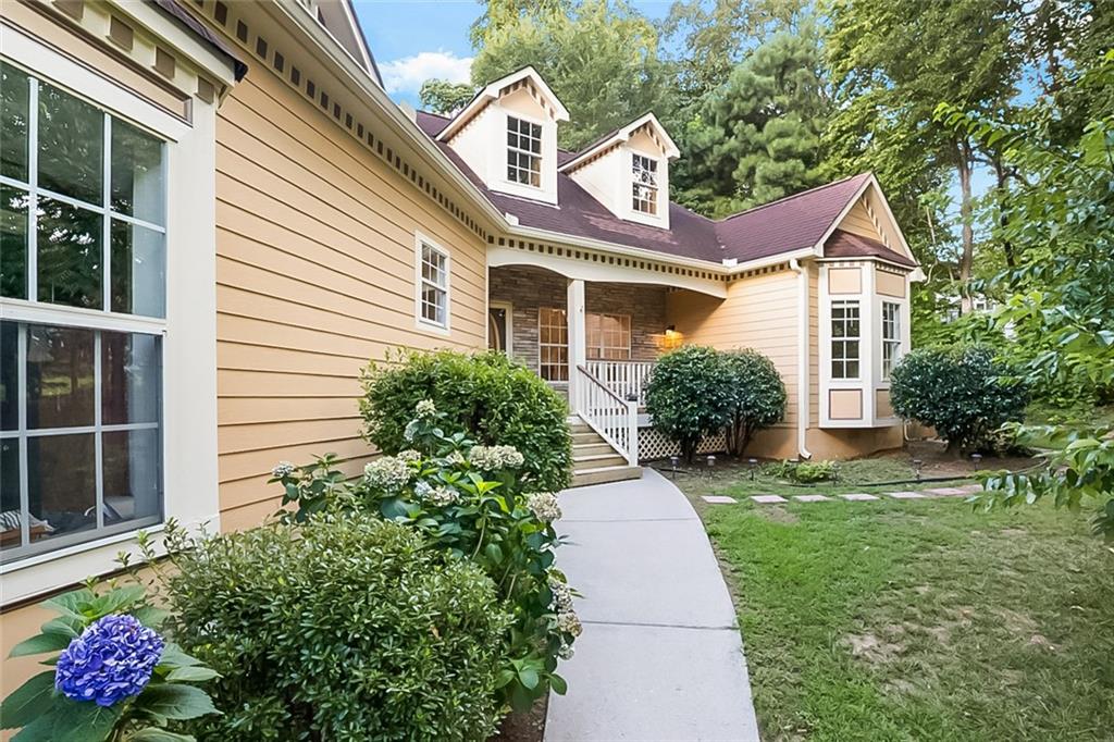 Welcome home! This well maintained raised ranch boasts a new HVAC, water heater, flooring, paint, rear deck, 5 year old roof, and includes a large shed with power! All appliances including washer/dryer will remain with the home for your convenience. Inside, you're greeted by the light-drenched open concept living area with a split floor plan. The kitchen offers great views into the family room and generously sized dining room. The primary bedroom offers an ensuite with ample storage, dual vanities, shower, and separate soak tub to relax in after a long day. Enjoy morning coffee on the peaceful front porch, fireside family time in the gorgeous living room with built-ins, and evenings in the private back yard perfect for entertaining. The oversized garage also has additional storage with extra shelving. Get away from it all in your own oasis, while still being close to the city, dining, shopping, easy commute access and so much more. Don't miss this opportunity to get into a great community, take a tour today!