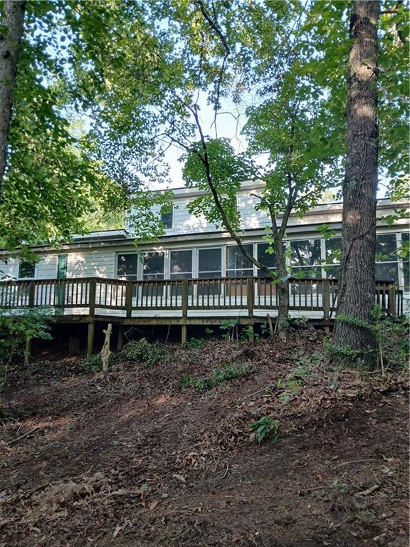 Country Ranch Cottage with Endless Potential! Discover this cozy
2 bedroom, 2 bath ranch cottage with versatile loft space, perfect for a
first-time home buyer, retired couple or savvy investor for rental or flip.
Situated on 1.25 acres along scenic Etowah River Road. This property offers
privacy, space and freedom with no HOA restrictions.
Build your dream home-the possibilities are endless. The lot could be cleared
to create the ideal homesite. Bring your builder and imagination!