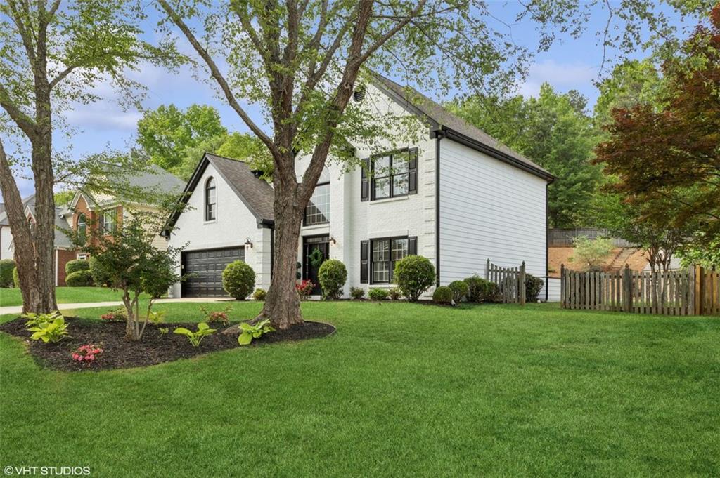 Discover this beautifully updated home in the highly sought-after Hembree Grove subdivision—a perfect blend of modern comfort, timeless style, and thoughtful functionality. Step inside to find a home that has been meticulously maintained and upgraded throughout.
The fully renovated primary and guest bathrooms offer spa-like luxury with sleek lighted mirrors, contemporary fixtures, and a Bluetooth-enabled exhaust fan in the primary suite. Additional recent upgrades include Fresh exterior and interior paint, new carpet in Family room and new water heater. Overall, there are over $60,000 worth of recent upgrades.
At the heart of the home is an oversized family room, ideal for entertaining or everyday relaxation, complemented by a versatile flex space—perfect for a home office, study nook, or extended sitting area. The chef’s kitchen boasts granite countertops, stainless steel appliances, and a classic tumbled stone backsplash—ready for everyday meals or hosting guests. Retreat to the spacious primary suite, which includes a private sitting area—ideal for unwinding, reading, or a quiet workspace. Three additional bedrooms upstairs are generously sized and filled with natural light. Enjoy outdoor living in the fenced backyard oasis, featuring a tiled patio, charming dollhouse, play set with swings, and fruit trees (blueberry, peach, persimmon, and fig)—a perfect setting for families and gardeners alike. Located in an active swim/tennis community, this home offers easy access to downtown Roswell and is within walking distance of top-rated elementary and middle schools. Don’t miss the opportunity to make this upgraded, move-in-ready gem as your future home!