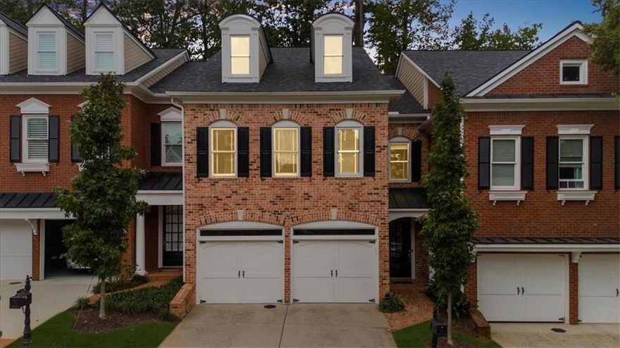 Are you ready for the downtown Alpharetta lifestyle? This three-level renovated townhome in Academy Park is just a short walk to all the shops and restaurants on the Square, with resident's gate to Alpha Loop and Avalon only steps away. Major renovations costing $160,000 have been completed, including the kitchen and all bathrooms and refinished hardwoods on main level.  The kitchen was reconfigured and now open to the family room, featuring white cabinets, subway tile backsplash, timeless granite, and new stainless appliances. Enjoy direct access from the two-car garage into the main-level kitchen, which flows into the spacious family room with fireplace and open to dining area, fenced courtyard patio has landscaping & grass area for pets and backs to woods.  The second level includes a brand-new spa-like primary bath with soaking tub, glass walk-in shower, dual vanities with lighted mirrors, and a large custom walk-in closet. Two guest rooms share a fully remodeled bath with walk-in shower and double-sink vanity. Also on this level are a laundry room and built-in desk with shelving. The third-floor flex room features a renovated full bath and offers options for a studio, office, media room, or fourth bedroom. Enjoy maintenance free living at Academy Park, gated with lighted tennis/pickleball courts, Jr. Olympic swimming pool, clubhouse, fitness center & nature trail, onsite management.