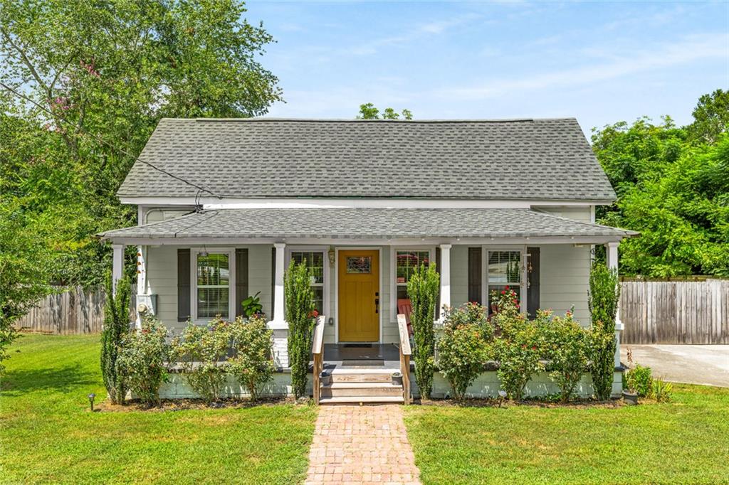 This beautifully renovated bungalow blends charm with modern updates from top to bottom. Welcome guests on the spacious front porch, perfect for relaxing. The sunlit kitchen features stainless steel appliances, quartz countertops and offers generous space for cooking and gatherings. Step outside to the wraparound back deck—ideal for grilling or unwinding.
The level, fenced backyard provides plenty of room for play, gardening, or pets. The primary bedroom includes a private bath with a walk-in shower, while the guest bedroom offers flexibility as a home office or bonus space.
A long driveway provides ample parking. Conveniently located near I-20, dining, shopping, and schools—this move-in ready home is just waiting for you to make it your own.