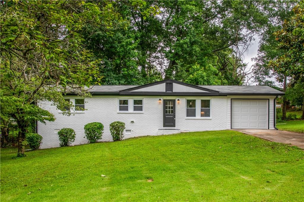 Welcome to this beautifully updated 3-bedroom, 2-bathroom ranch-style home located in the quiet, established community of Austell. Step inside to discover a bright and open floor plan, featuring luxury laminate flooring throughout the entire home, fresh new painting , modern light fixtures that add a touch of elegance.
This renovated home has a spacious living room that flows seamlessly into the brand new kitchen, which is equipped with Quartz countertops, beautiful white subway tile backsplash, stainless steel appliances, and finally white shaker cabinets which are perfect for both entertaining and everyday cooking.
The primary suite offers a private retreat with an brand ensuite bathroom featuring a tiled walk-in shower, updated vanity, and sleek finishes. Two additional bedrooms provide ample space for guests, a home office, or a growing family. The second full bath includes contemporary fixtures, and a second well thought shower/tub combination.
Outside, enjoy a large fenced-in yard and driveway ideal for pets, children playing, or weekend barbecues. A new roof, newer HVAC system, and ample driveway parking round out the wonderful extras with this property.
This property is minutes from shops, dining, I-20, and just a short drive to downtown Atlanta, this home combines comfort, style, and convenience all in one. Move-in ready and waiting for you—schedule your tour today!