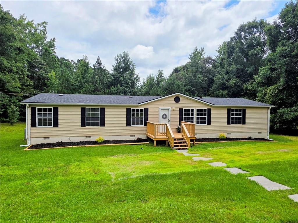 MOVE IN READY on this Completely Remodeled Home on 6+ acres! Welcome Home to this 3 bedroom, 2 bath home in Beautiful Forsyth! You will love this Open Floor plan with almost 2000 sq ft, where you have a very large Open living area w/fireplace that opens up to the beautiful Gourmet kitchen with updated cabinets, new granite countertops, brand-new stainless-steel appliances, that moves into a large dining room. The primary bedroom is very spacious and has a walk-in closet. In the en-suite bathroom you will find another large walk-in closet, brand new double vanity, an amazing standalone soaking tub, new shower and toilet. The home also features a split bedroom plan, so on the other side of the home you will find 2 large secondary bedrooms with walk in closets and an updated hall bath. All new flooring, paint, water heater, light fixtures, plumbing fixtures, deck, front porch, some new windows, interior doors, counter tops, cabinets and more! The brand-new back deck is large enough for all of your outdoor furniture and grill to enjoy the wonderful, peaceful evenings in the country! Sitting on over 6 acres of land, you have all the privacy you could ask for! Perfect for the people wanting their own land to enjoy or hunt. Roof is only 3 years old, too! Being only about 5-7 mins from I-75, 10 mins from downtown Forsyth with the great dining and shopping on the square, great Monroe County schools, and all the benefits of private, country living, and ALL of the Wonderful Upgrades, you couldn't ask for a better home! Perfectly Move In Ready!