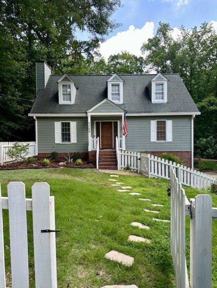 Welcome Home! You'll never want to leave once you step into this charming 4-bedroom, 2.5-bathroom cottage nestled on 5+ stunning acres in Cobb County. Yes, 5+ acres—a rare find in this area! Everything you need is right here. Enjoy the spacious chef-style kitchen, renovated bathrooms, and master suite on the main floor. Two bedrooms upstairs provide extra space, while an additional bedroom is conveniently located near the 2-car garage.

Evenings on the brand-new back deck with a refreshing glass of choice? A must! If you're a golf enthusiast, you'll love the golf pad in the back yard, making it easy to practice your swing while relaxing near the new fire pit—a perfect weekend routine.

This home is the perfect escape from the hustle and bustle while keeping you close to everything. A true dream cottage—you won’t just visit, you’ll belong.