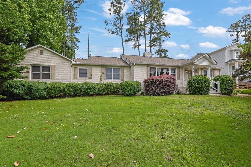 Welcome home to this charming ranch-style brick residence, located in the highly sought-after Hillgrove High School district. Ideally located just 10 minutes from Marietta Square and less than 10 minutes from the shops and dining at West Cobb Avenues. This 3-bedroom, 2-bathroom home offers a perfect blend of comfort and functionality, including a very spacious bonus room complete with a cozy fireplace - perfect for a second living area, game room, media room, or home office.

As you step into the main living room, you're greeted by an inviting open space with a fireplace framed by built-in shelving. The open kitchen features a central island that doubles as a breakfast bar. The kitchen comes equipped with a gas stovetop, oven, refrigerator, and microwave.

The adjacent dining area provides direct access to the fenced-in backyard. The backyard has a large patio and fire pit, perfect for entertainment. Both bathrooms have been updated, and beautiful hardwood floors flow throughout the living room and all three bedrooms, adding warmth and charm.

Additional features include a garage with electricity, offering extra storage or workspace. Don’t miss this move-in-ready gem in a prime location—schedule a showing today!