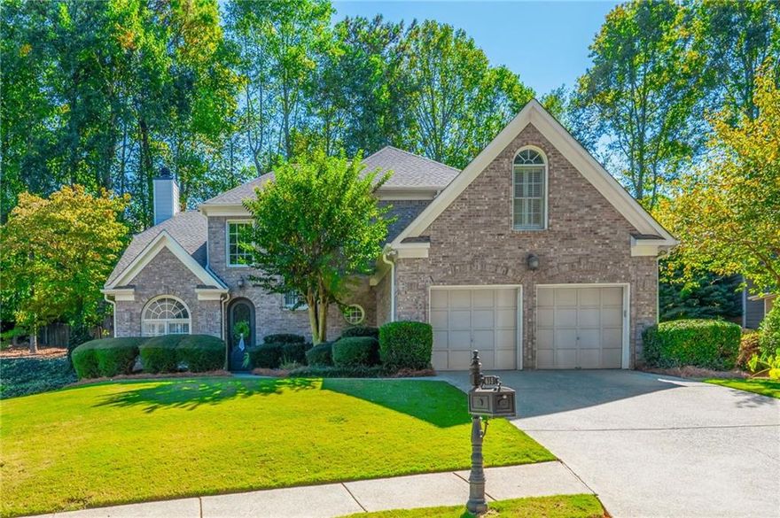 Welcome Home! Tucked within the sought-after Park Creek Swim/Tennis Community. Inside a soaring two-story foyer introduces recently replaced hardwood floors, crown molding and wainscoting details and a formal dining room. The recently renovated designer kitchen offers a large center island with custom natural wood cabinetry and gleaming quartz countertops, white perimeter custom cabinetry to the ceiling, a gas range, and subway tile backsplash. The living room features a cozy wood-burning fireplace with a brick and shiplap surround and large rustic wood mantel, flanked by custom shelving, built-ins and lighting. Charming keeping room with gas-burning fireplace with white brick surround and rustic wood mantel makes a natural gathering space. The spacious primary suite is located on the main floor. En-suite bathroom features double vanities with stone countertops, frameless glass travertine tile shower, soothing soaking tub and updated light fixtures. The upper level of the home features recently replaced designer carpet, three large bedrooms, two full bathrooms with stone countertops and new lighting, and a bonus room perfect for a home office or play area. All closets have custom organizational systems. French doors from the kitchen lead to a large paver patio with outdoor lighting, professional landscaping, fenced backyard, beautiful stacked stone retaining wall and firepit area perfect for cool nights. The exterior of the home is very low maintenance with brick front and hardiplank siding. A truly move-in ready home as HVAC systems, roof, and water heater have all been recently replaced. Conveniently located in award award-winning school district, close to GA-400, Avalon and downtown Alpharetta.