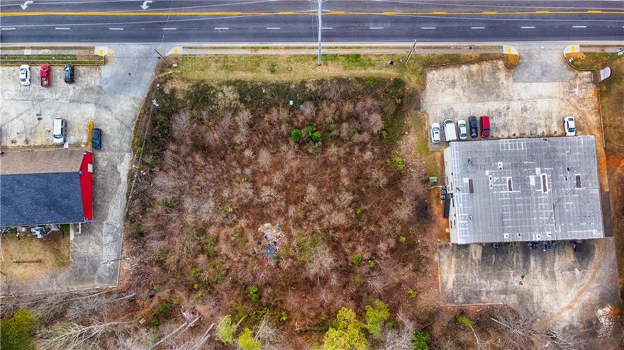 Unlimited potential at 285 Windy Hill Rd. SE, Marietta GA. Location, location, location on Windy  Hill Road with a traffic count over 40,000 on a lot size of 1.139 Acres.  Zoned “NRC” with endless possibilities: retail, restaurant, commercial, shopping facilities and more! Prime property with high visibility close to The Battery, Braves Stadium, Historic Marietta Square, Smyrna Village, I-75 and more! This property offers maximum exposure for all your business needs!
Attain distinction & success in Marietta’s highly developed commercial area.  This lot offers a blank canvas to make your business dreams a reality.  Offering capitalization on location and great long term investment!  Contact Cardinal Point Realty to discuss your business aspirations and  endless possibilities on this amazing land lot today!