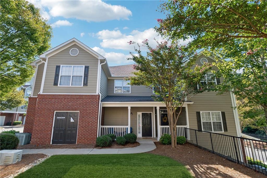 Welcome to your DREAM home nestled in the serene, gated Woodlands At Webb Bridge community. This beautifully updated condo sits in an unbeatable location, just steps from DOWNTOWN Alpharetta and AVALON. Enjoy upscale living at an affordable price in one of North Fulton’s most sought-after neighborhoods! Thoughtful split-bedroom floor plan ensures privacy, with a PRIMARY suite featuring custom walk-in closets and romantic French doors opening to a private balcony. Newly installed hardwood-like floors, quartzite countertops, stylish backsplash, and stainless steel appliances create a sophisticated and inviting atmosphere. A NEWER HVAC unit and roof add peace of mind. The fireside family room flows seamlessly into an open-concept dining area and a sleek white kitchen with a breakfast bar, perfect for entertaining guests or COZY nights in. Savor morning coffee on the covered front porch or unwind on the PRIVATE balcony with tranquil wooded views. Additional storage off the patio keeps things organized.
Enjoy GATED security, a clubhouse, sparkling pool, and pet-friendly walking paths, including a charming trail to Avalon. Perfect for those who love both city vibrancy and outdoor escapes. Includes a 1-car GARAGE, driveway, and ample unassigned parking spaces nearby for guests or roommates.
Located just minutes from Avalon’s upscale shopping, dining, and entertainment, and a short stroll to Downtown Alpharetta’s vibrant farmer’s market, concerts, and Alpha Loop trails, this condo offers the best of both worlds. Explore the nearby Greenway Trail for biking or hiking, or enjoy the quiet charm of this gated community with serene, wooded surroundings. With EASY access to GA-400, you’re perfectly positioned for work or play.
This meticulously maintained condo is move-in ready, offering affordable luxury with modern upgrades and low-maintenance living. Ideal for professionals, small families, or roommates, it’s a rare opportunity to own in a prime Alpharetta location. Don’t miss your chance to experience the perfect balance of urban excitement and suburban tranquility!