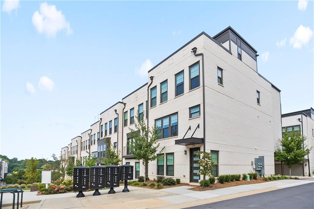 Rare 4 story Townhome rental with a rooftop loft and double rooftop sky decks lined with artificial turf! SHOWING BY APPOINTMENT ONLY. DO NOT DISTURB. **Minimum requirement: No housing voucher, 680+ Credit score, clear background check, verifiable income, rent & debts not to exceed 40% of total combined monthly income, proof of savings of $9000+, good references...etc.) Luxury living at its best in this prime West Midtown location! Premium End-Unit corner lot tucked away from the busy street noise. Upscale Interior design upgrades throughout the unit! (White Oak tone flooring, modern light fixtures, plumbing fixtures, window treatment and custom closet systems). Terrace Level: Two story entry foyer, Guest bedroom and full bath, Rear entry two car garage. Second Level: Open-concept kitchen, Dining area, family room, half bath and a multi-purpose sunroom next to the rear balcony deck. Third Level: End-unit bedrooms offers additional windows for even more natural light. Oversized Primary bedroom with a sitting area, walk-in closet with custom closet system, double vanity with ample amount of counter & cabinet space. Laundry closet, en-suite bedroom with custom closet system. Forth Level: Multi-purpose rooftop loft, half bath, and double sky decks with artificial turf! Quick access to restaurants, shops, High Museum, SCAD, Atlanta's famous attractions, I-75/85 highway and walking distance to the upcoming Westside Beltline Extension.
