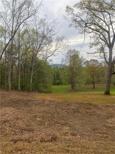 1.7 acre (Tallulah Falls) graded, cleared and ready for your homesite. Year round views of Hickory Nut Mountain. 12x28 shop with side and rear lean too roof system. Perk test completed & land is 95% fenced!!