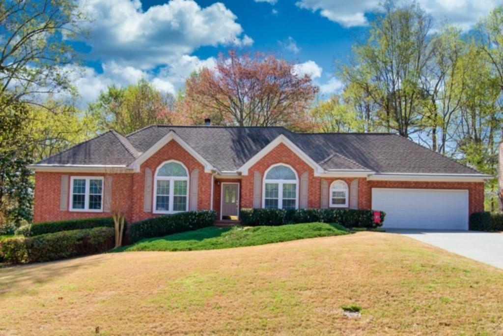 Beautiful Ranch home nestled in the cozy Suwanee subdivision of Falcon Creek. Updated kitchen with stainless steel appliances and a centry kitchen feel with the perfect view of the private back yard. Spacious closets, 3 large full bathrooms on the main floor and a basement ready for entertaining. Basement area is complete with garage door that opens up to your private work area or storage. This home is a must see with a perfect location and short drive to downtown square.