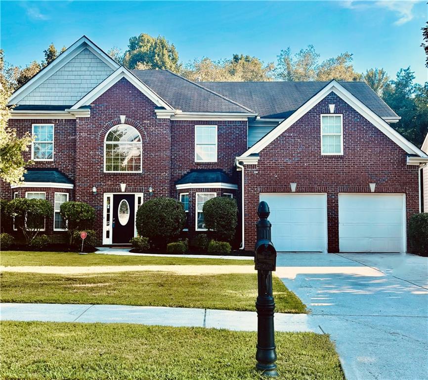 Welcome to this beautiful 2-story brick-front home located in the highly desirable Oak Field Community within the Gwinnett County School District. This move-in ready home offers 4 bedrooms, 2.5 bathrooms, and generous living spaces perfect for both everyday comfort and entertaining. Interior Features: Elegant formal dining room and separate breakfast area, High-top counter bar ideal for casual dining and gatherings, durable and stylish LVP flooring throughout the main level, painted kitchen cabinets with ample storage and prep space. Striking foyer with painted columns and heavy trim detail`ing. Formal living room and a cozy family room with fireplace overlooking the backyard. Tons of closet space and storage throughout the home. The Owner's Suite offers very spacious primary bedroom featuring a fireplace and a private sitting area. Spa-like ensuite bath with a garden soaking tub, double vanity, standup shower, and private water closet, massive walk-in closet with room to spare. 3 well-sized secondary bedrooms upstairs, all with carpet, full hallway bath with tub/shower combo, convenient half bath on the main level, attached two-car garage. Located in a quiet, established neighborhood close to shopping, dining and entertainment. This home combines space, charm, and a fantastic location - everything yu've been looking for in Loganville! Call today to schedule your private showing!
