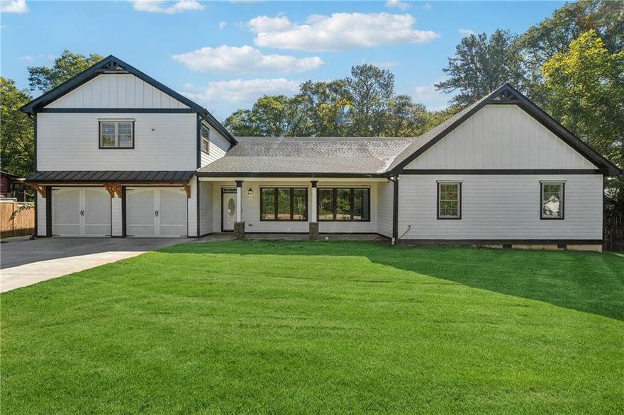 Welcome to this stunning custom-built, energy efficient Farmhouse style home in Marietta! Features Bright and airy living area with 10+ ft ceilings and exposed beams, Gourmet kitchen with ample cabinet space, waterfall island and butler's pantry. 2 Oversized master suites with tray ceilings, fireplace, and his/her closets.  Additional ensuite bedroom on main floor. Generous storage space in attic and in 8ft ceiling crawl space. All of this in one of the best school districts in GA. This home combines luxury, comfort, and practicality in a perfect blend!