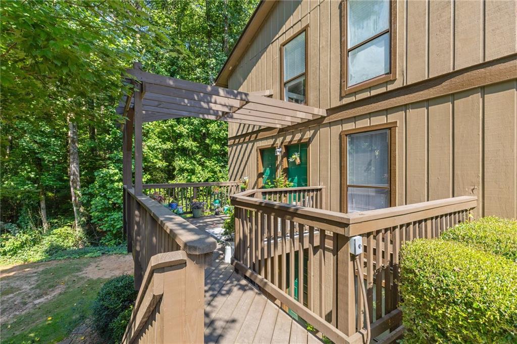 Nestled in the heart of Tucker, GA, you'll find the inviting haven of 3845 Cedar Circle. This delightful top floor home has an open floor plan with tons of natural light, new luxury vinyl flooring, an updated bathroom, and a brand new gas stove and microwave. As you step inside, there's an extra space under the stairs which can be used as an office. Once you walk up the modern staircase, you'll love the large den that has a cozy fireplace and built in bookshelves. One of the most enchanting features of this property is the screened in porch, which extends from den and offers a serene escape with its picturesque views of the wooded backyard. Whether you're sipping your morning coffee or hosting a weekend barbecue, this space is a true retreat. With no rental restrictions and detailed maintenance records available, this condo offers peace of mind whether you’re planning to call it home or rent it out. The transferable home warranty covers all major systems, including HVAC, appliances, and electrical, adds an extra layer of protection. Water and Trash are included with HOA. Located within a half mile of Hwy 78 and I-285, and close to Northlake, Decatur, and Emory, Cedar Circle offers both convenience and community. Enjoy the amenities including aswimming pool and tennis courts while surrounded by beautifully landscaped exteriors that reflect the pride of this friendly neighborhood.
