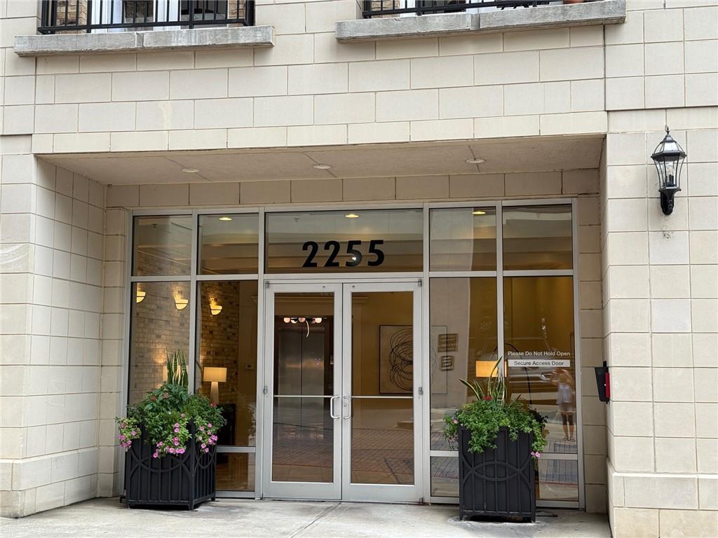Welcome to this bright and spacious 1-bedroom, 1 and ½ bath condo in one of Buckhead's most prestigious condo communities. Located in a gated building with large quiet hallways. This home is perfect for those seeking upscale urban living with unbeatable convenience between Buckhead and Midtown overlooking the golden mile of Peachtree between the two. This is truly easy living with two gated parking spaces on the same level as the property, a secure building and a quiet oversized hallway. Enjoy all the activities on Peachtree from your balcony! The home has new appliances, new lighting, fresh paint and new carpet (to be installed soon) with genuine stone tile in the kitchen and bathrooms. Take advantage of resort-style amenities including a rooftop patio with skyline views, grilling stations, outdoor fire pit, sparkling rooftop pool and pool deck, state-of-the-art fitness center and cardio gym, conference room, and a rentable guest suite for visitors. AS AN ADDED BONUS, the Atlanta Beltline expansion is expected to reach this area in June 2026, unlocking even greater connectivity and long-term value.
