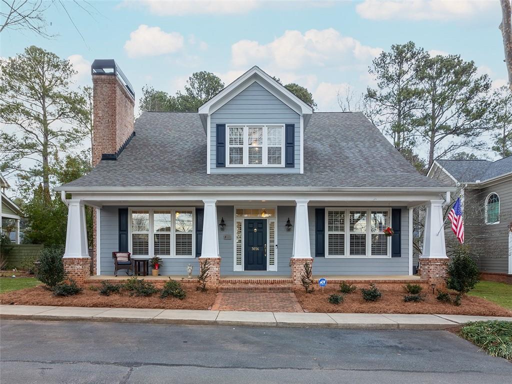 Nestled in the charming Cherrytree subdivision within the top-rated Pope High School district, this beautifully craftsman-style home is ideal for those seeking a refined lifestyle in a peaceful, intimate community. Located in the heart of East Cobb this property blends timeless appeal with modern features tailored for convenience and ease of living. The primary suite on the main floor provides a serene retreat, complete with a cozy fireplace, an expansive walk-in closet, and a generously sized bathroom outfitted with a dual-sink vanities and an accessible shower. The bright, open kitchen boasts granite countertops, newer appliances, and a central island that flows seamlessly into the living room with its own fireplace, making it ideal for entertaining or quiet evenings at home. Upstairs, generously sized secondary bedrooms and den/office space provide room for guests or hobbies. This quality constructed home, featuring soaring 10-foot ceilings and built-in cabinets and bookcases throughout, has been further elevated with plantation shutters and newly refinished hardwood floors. Energy efficiency and low upkeep are key, with upgrades including a new HVAC system, new hot water heater, double-pane windows, and a newer roof. The covered patio and manageable backyard are perfect for gardening or relaxing, while the rocking chair front porch invites you to enjoy your morning coffee or connect with neighbors. Conveniently located near shopping, dining, and parks, this home offers the perfect balance of modern amenities and timeless appeal. Schedule your showing today—homes in Cherrytree are rarely available!