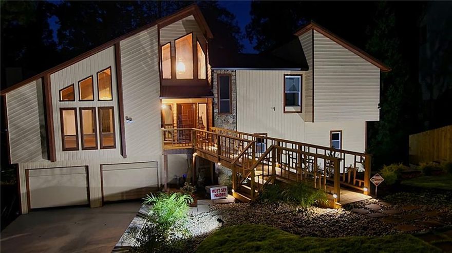 This house is nothing short of a paradise. As of 10/2025 it's an all-new home from floors to ceilings and everything in between, inside/out with a $200,000 renovation on,  by far, the best and the most beautiful lot in the highly desirable $1,000,000 - East Cobb community, East Spring Lake, a hidden gem, where all homes sell within days and house FEELS much LARGER than the numbers show. Seriously, this is a once-in-a-lifetime opportunity. As one of the last top-quality contemporary homes built in North Atlanta area, it offers spaciousness and brightness with modern simplicity unmatched by any home being built today.   This 4-5 bedroom jewel with 3 amazing shiny-new baths will be the envy of all your friends and family forever.  After all, whom do you know who falls asleep with the sound of a peaceful fountain in their bedroom or office, who cooks on movable kitchen island on wheels with brakes in a sun-filled kitchen on counters tops that shimmer with the rays of sunlight reflected in crystals, and who can house important family or friends in an incredible in-law suit with marble bathroom and a large steam room, incredible lake-side family room with a deck and a special walkway to the private pond with a fountain as a private retreat for a shady afternoon beer or tea.   No person who has ever entered this home ever forgotten it, and neither will you.