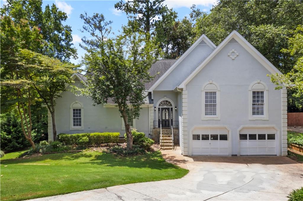 Welcome to your dream home in the heart of East Cobb, nestled in one of the most desirable and top-rated 10/10 school districts around! This stunning 6-bedroom, 3.5-bath beauty offers the perfect blend of comfort, charm, and functionality. From the moment you step inside, you’ll be captivated by the spacious layout and thoughtful details throughout. The inviting family room features a cozy stone fireplace and custom built-ins, perfect for gatherings or quiet evenings at home. Entertain in style in the elegant formal dining room, or cook up something special in the light-filled kitchen, complete with classic white cabinetry, double ovens, a generous pantry, and breakfast bar for casual meals. The luxurious oversized owner's retreat is a true sanctuary, boasting a deep tray ceiling, a bright bay window, spa-like ensuite with double vanities, soaking tub, separate shower, and a walk-in closet that dreams are made of. Secondary bedrooms are spacious and versatile, ready to accommodate family, guests, or a home office. Downstairs, the fully finished basement adds even more living space, featuring a kitchen area, large flex room, additional bedrooms, and a full bath. Step outside to enjoy peaceful mornings on the enclosed screened porch or host unforgettable summer evenings on the expansive deck. Perfectly located just minutes from I-575 and I-75, this gem offers unbeatable convenience in a prime East Cobb location. Opportunities like this are rare—don’t let this one pass you by!