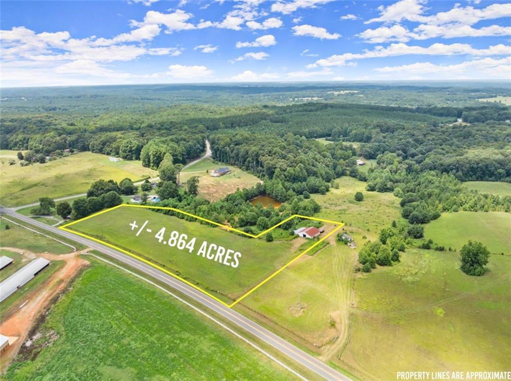 Spanning over 4.86 acres of beautifully maintained pasture, this property features a four-stall barn-perfect for you to bring your animals. It already includes a well, electricity, and a septic tank, ready for you to build your dream home. Enjoy peaceful country living just minutes from town, schools, shopping, and dining, with easy access to I-85 for added convenience.