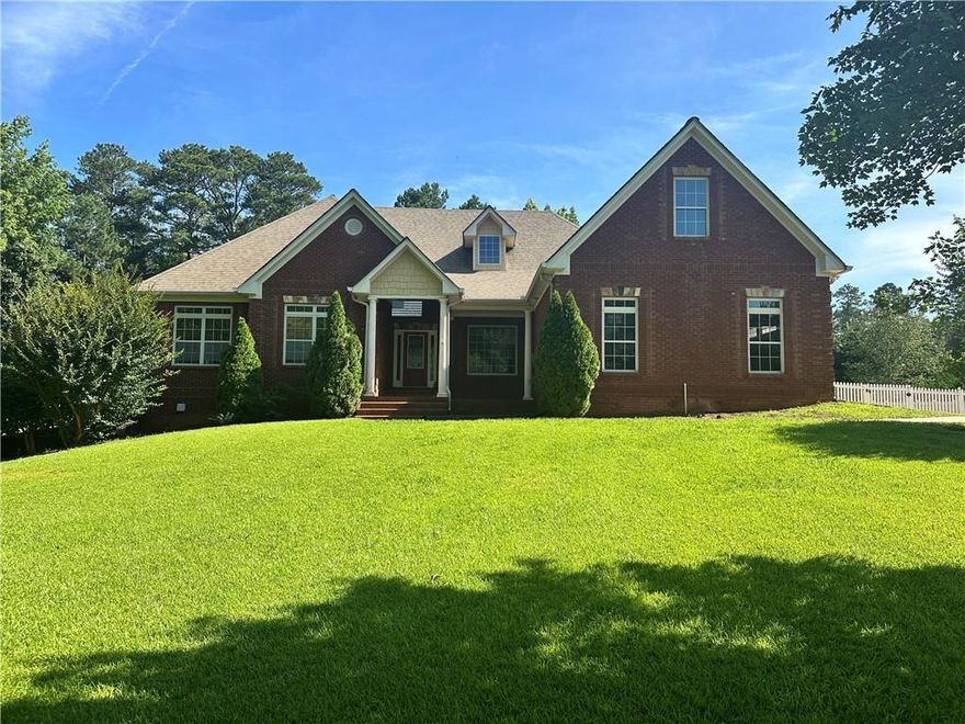 Beautiful brick home in Newton County. Master on main with trey ceilings, Master bath with spa tub, separate shower, separate vanities and walk in closet. Kitchen w/granite counter tops, custom kitchen cabinets, island containing sink, dishwasher, separate cook top and wall oven, breakfast area and walk in pantry. Kitchen opens to family room w/fireplace. Separate dining room. Hardwood floors throughout main living area. Upper-level suite with living room, bedroom, and full bath. Full unfinished basement with 95% of HVAC installed and Partial Bath. The septic is permitted for 1 bedroom/1 bath to be finished in the basement. We have a quote from contractor to finish basement and will share with a potential buyer. Covered deck off rear. Enclosed side yard with white picket fence. Main interior of the home has freshly painted walls and trim. Irrigation system.