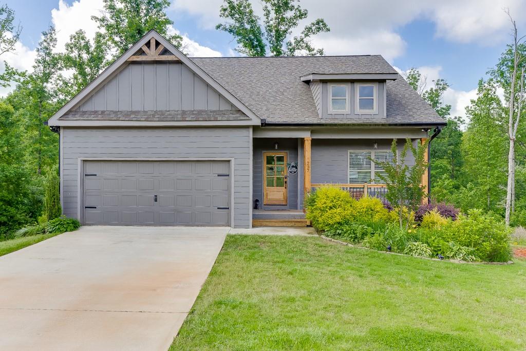 Welcome to Your Dream Home in Commerce!
Built in 2021, this stunning residence offers spacious, refined living with thoughtful design and upscale finishes throughout—far from your standard builder-grade home. Situated on over 2 peaceful acres in a quiet cul-de-sac, this property provides the perfect balance of privacy, tranquility, and convenience.
The main level features a luxurious primary suite complete with a spa-like ensuite bathroom and generous walk-in closets, offering a serene private retreat. You'll also find two additional bedrooms, a full bath, and a well-placed laundry room on this floor. The open-concept layout seamlessly connects the living, dining, and kitchen areas, creating an inviting space for everyday living and entertaining. Step outside to the screened-in porch or open-air deck, perfect for morning coffee or evening barbecues while enjoying the sounds of nature.
Upstairs, a spacious fourth bedroom with its own full bath offers ideal accommodations for guests or family members seeking extra privacy. The fully finished terrace level expands your living space even further, featuring a large open area perfect for entertaining, relaxing, or hosting movie nights. This level also includes a versatile flex room that can serve as a guest room, home gym, or hobby space, an additional office area, another full bathroom, and two large unfinished rooms perfect for storage or future expansion.
With its smart, flexible layout and elegant detailing, this home is designed for modern living and effortless comfort. Located just minutes from shopping outlets, restaurants, and major highways, you’ll enjoy easy access to popular destinations like Lake Hartwell, Helen, Lake Lanier, and Athens.