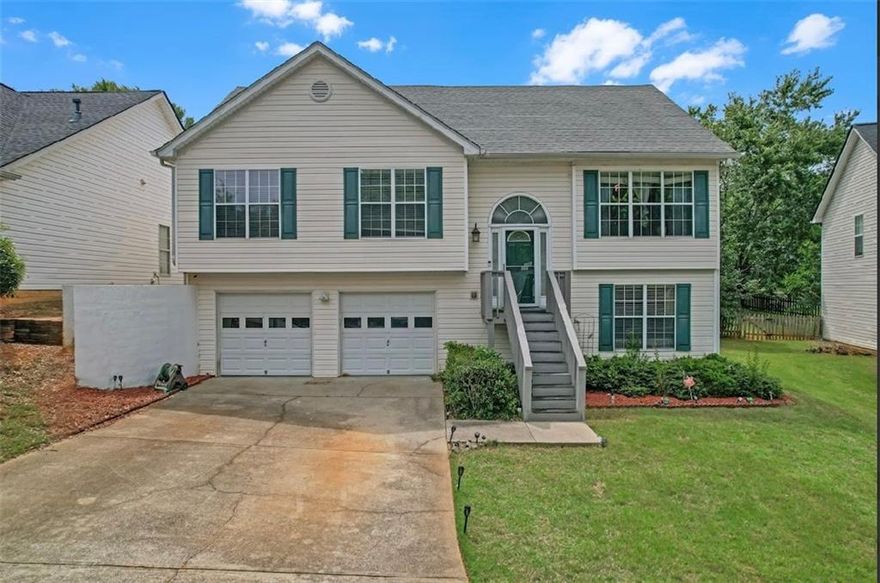 Welcome to this charming split-level home in the desirable Liberty Commons neighborhood! This home features an open and bright floor plan with vaulted ceilings and hardwood floors throughout the main level. The updated kitchen boasts granite countertops, stainless steel appliances, and plenty of storage - perfect for cooking and entertaining. The oversized primary suite offers a peaceful retreat with a spacious bathroom featuring a soaking tub and separate shower. Two additional bedrooms and a full bath complete the main level. Downstairs, enjoy a large finished daylight basement with a media room, an extra bedroom, full bathroom, and convenient laundry area. The basement has both interior and exterior access to the fully fenced backyard with a spacious deck - ideal for relaxing or hosting gatherings. Liberty Commons offers fantastic community amenities including a pool, tennis and pickleball courts, playground, dog park, walking trails, and clubhouse. This home is conveniently located near Cobb Parkway and North Cobb High School, putting shopping, dining, and top schools within easy reach. Don't miss the chance to make this well-maintained, move-in ready home yours!