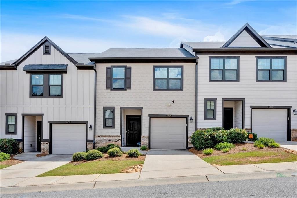 Welcome to this beautifully designed 3 bedrooms, 2.5 bath townhome by Ashton Woods,
nestled in the quiet and highly sought-after community of Overlook at Queens Creek in
Mableton. Step inside to a bright and inviting foyer that opens into a spacious, open-concept
main level featuring 9-foot ceilings and an abundance of natural light. The modern kitchen is a
chef’s delight, showcasing granite countertops, a generous 5-foot island with additional
storage, a walk-in pantry, and stainless-steel appliances. A dedicated dining area flows
seamlessly into the warm and welcoming family room, which leads to a private patio, complete
with privacy walls, ideal for relaxing or entertaining. A stylish powder room completes the main
floor. Upstairs, the serene owner’s suite offers a peaceful retreat with a luxurious en-suite
bathroom and a spacious walk-in closet. Two additional bedrooms share a full bathroom,
perfect for guests, a home office, or a growing family. The upper level also features 2" blinds
throughout and plenty of storage options. Whether you’re relaxing on the patio or enjoying
cozy evenings indoors, this townhome perfectly blends modern style with everyday comfort.
Ideally located with quick access to I-20 and I-285, you’re just minutes from Six Flags Over
Georgia, Truist Park/The Battery Atlanta, Smyrna Market Village, Atlanta Airport, and a wide
variety of shopping, dining, and entertainment destinations. Enjoy the convenience of ample
guest parking and easy access to the community pool, and cabana with just a short walk away.
Rental allowed (Units must be rented in their entirety and for at least 12 months, NO Airbnb).
Don’t miss this rare opportunity. schedule your private tour today!