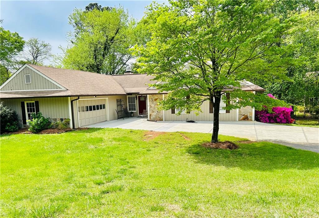 Award-Winning Walton School District – Prime Location on a Quiet Cul-de-Sac!
Welcome to this stunning traditional ranch home on a full basement, brimming with character and style! Nestled on a serene cul-de-sac street, this home offers an open-concept design that blends convenience with modern living. With high ceilings, ¾” hardwood floors throughout, and a side-entry garage, every detail is crafted for comfort and ease.
Step into the dramatic great room, where a vaulted ceiling with rustic beams and a floor-to-ceiling stone fireplace create a warm, inviting ambiance. Double sliding doors lead to the expansive screened porch, perfect for relaxing in the breeze while overlooking the private, fenced backyard—a dream space for games, sports, and firepit gatherings! Adjacent to the great room, the convenient kitchen boasts granite countertops, a stylish tile backsplash, and rich walnut-stained cabinetry. Outfitted with premium appliances—including a GE Profile oven & microwave, Bosch dishwasher, and Bosch 5-burner gas cooktop—this kitchen is designed for effortless cooking and entertaining. The sunny dining room overlooks the backyard, while a cozy den/sitting room off the kitchen offers the perfect spot for quiet conversations.
The spacious primary suite features a walk-in closet and peaceful backyard views. Its ensuite bath showcases a unique antique vanity with a brass sink, a large antique mirror, and a separate white china sink with an additional mirror, plus a walk-in shower. Two additional generously sized bedrooms share a beautifully updated bath with a charming antique double sink vanity and tub/shower combination.
Downstairs, the full basement offers incredible potential! Already featuring a finished office with sliding doors to a patio and backyard, the rest of the space—equal in size to the main level—is ready to be customized for a home theater, gym, recreation room, or in-law suite. Currently, it serves as storage for the owner’s construction business. With its prime location in the sought-after Walton School District, a picturesque lot, and endless possibilities for expansion, this home is a rare find. Don’t miss out—schedule your showing today!