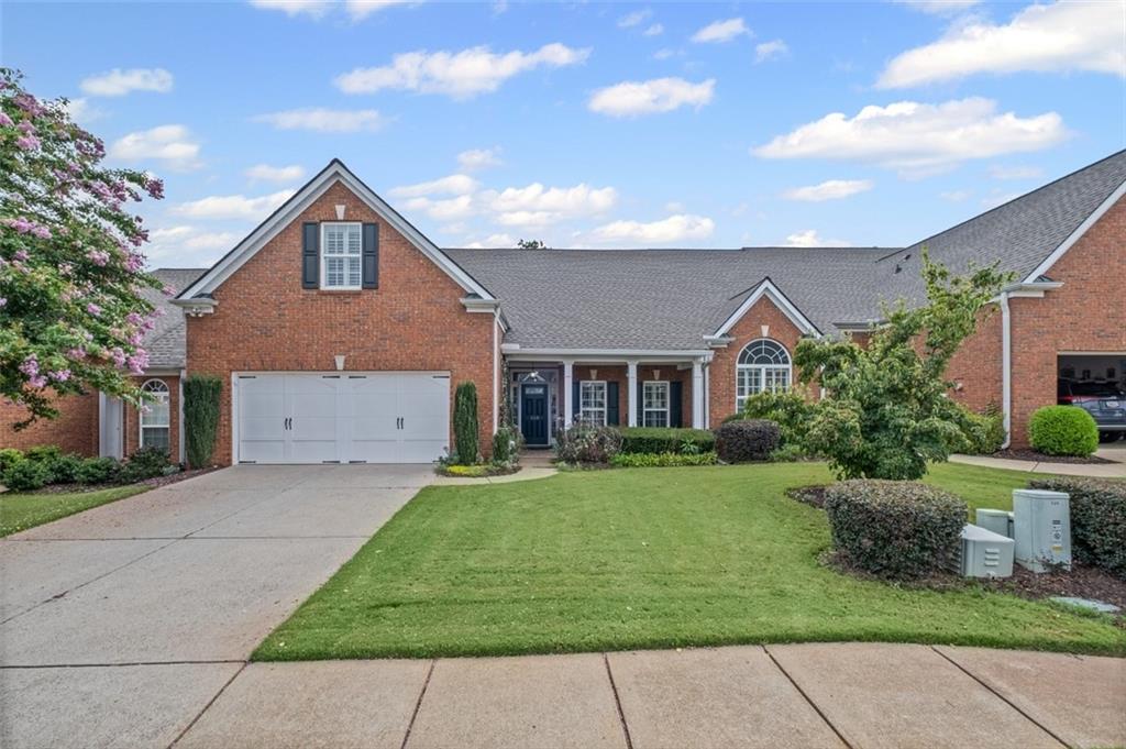 Discover this wonderful home in Claremore Lake, where everyday living feels easy and connected. From the step-free entrance, you're welcomed into a bright, open foyer that flows into the den and kitchen designed for gathering, entertaining, or simply enjoying a quiet evening in. The primary suite on the main level is a true retreat with vaulted ceilings and a peaceful view of the back patio. Another bedroom and full bath with 2 sinks complete the main floor, while upstairs offers a flexible bedroom space perfect for guests, a home office, or a hobby room with its own private bath. With new carpet and luxury vinyl plank flooring added in 2025, the home is ready for your personal touch. Life in Claremore Lake is all about convenience and connection. Residents enjoy a clubhouse, pool, exercise room, planned social activities, lawn care, and exterior maintenance, giving you more time to relax and enjoy your surroundings. Step outside your door and you're within walking distance to shopping, dining, and Onelife Fitness. Downtown Woodstock and I-575 are just a quick drive away. With the HOA replacing all roofs in 2022, you can move in with peace of mind. This isn't just a home; it's a lifestyle, ready for you to make it your own.