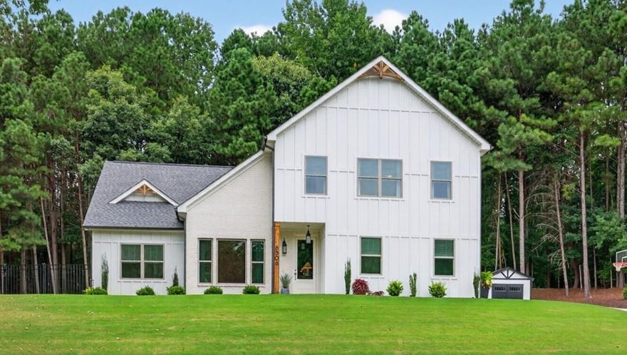 ***Seller says SELL! It's your lucky day to have a chance at this beautiful two year new home with custom upgrades galore!!*** This 4 bedroom (with one bedroom on the main!), 3 full bath home has been thoughtfully designed and upgraded inside and out, creating the perfect blend of style, function, and comfort...with NO HOA! Step inside and you'll immediately notice the NATURAL LIGHT pouring in, highlighting the open flow of the living room, dining area, and kitchen. The upgraded lighting, and stylish accent walls give the home character and warmth. The gorgeous kitchen with its LARGE ISLAND and its endless cabinetry and storage is the heart of the home where everyone gathers. The OPEN CONCEPT continues into the cozy and inviting family room, offering the perfect spot for movie nights gathered around the gas fireplace. And what a thought-out floor plan, offering a bedroom and full bathroom for guests or as an IN-LAW SUITE on the MAIN LEVEL. Every detail has been considered, from upgraded molding around doors to the iron spindles along the staircase. Upstairs, the OVERSIZED PRIMARY SUITE is a true retreat, complete with a spa-like bathroom featuring a soaking tub, large tiled shower, and walk-in closet. Two additional generously sized bedrooms share this level, along with a third luxurious bathroom. The home has been expanded with a COMPLETE RENOVATION of the ATTIC SPACE, creating additional square footage you'll love. A new extended hallway leads to a spacious laundry room and a versatile flex space, perfect for an office, extra bedroom, or playroom. And the storage is incredible, with a walkable attic, garage closets, and even ceiling stairwell access to more attic space. When you step outside, the upgrades continue. The backyard is private and peaceful, ideal for grilling out, hosting a corn hole competition with your friends, or enjoying a quiet evening gazing at the stars. The aluminum fencing with lighting sets the stage for entertaining, while the professionally landscaped yard with river rock accents makes it low-maintenance and beautiful year-round. A custom-built 10x12 shed with ramp adds convenience, and the SIDE-ENTRY garage has been finished with a GRANITE-COATED FLOOR, great for parking, a home gym, or even extra entertaining space. The EXPANDED DRIVEWAY with in-ground basketball goal completes the perfect outdoor setup. To top it all off, the location is unbeatable! This beautiful home is CONVENIENTLY LOCATED NEAR I-985, ***FAMOUS LAKESIDE RESTAURANTS like Fish Tales and Pig Tales*** Flowery Branch Bay Park with picnic and playground areas ***SHOPPING - Kohls, Target, Home Depot, TJ MAXX, Publix*** Alberta Banks Park around the corner with Tennis/Pickleball Courts/Playground/Softball and Baseball Fields*** LAKE LANIER ISLANDS MARGARITAVILLE & WATER PARK *** For the golfer; Royal Lakes and Chicopee Woods GOLF COURSES are less than 15 minutes away**** Quaint DOWNTOWN FLOWERY BRANCH with cute shops, restaurants and local events is about a mile away. This home truly has it all: thoughtful design, abundant upgrades, and a warm, inviting atmosphere ready for its next owner! Call today for your private tour! **Optional additional purchase/consideration: Outdoor Kitchen/Bar from Paradise Grills Maui 8 Set + GX8 (includes grill, 4 bar stools, wired blue tooth with installed speakers, two beverage coolers, lighting, temperature-controlled drawers and storage). One year (new) - purchased Sept. 2024***