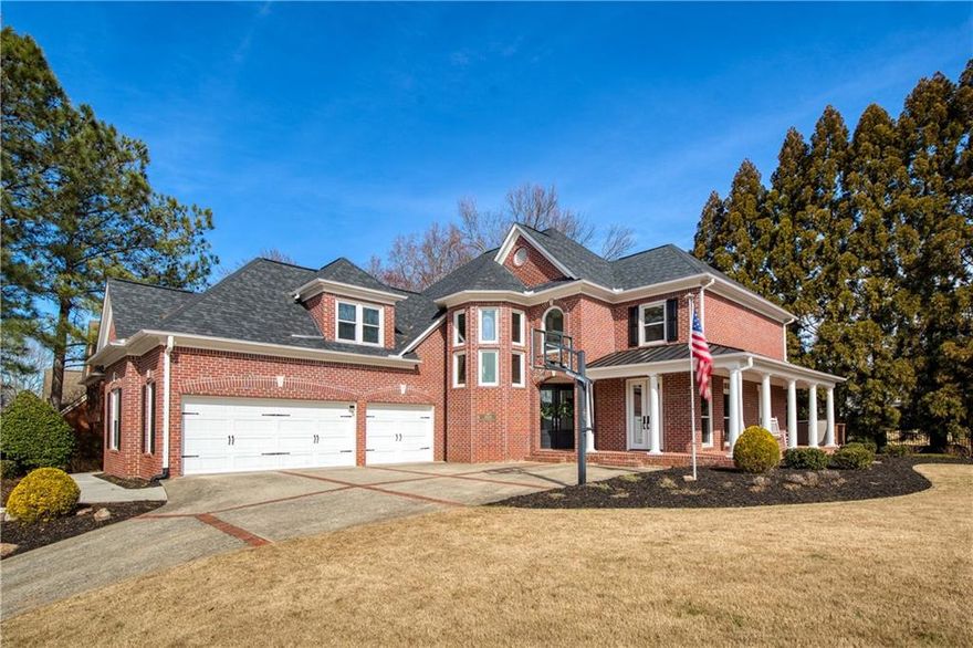 Welcome to 1605 Ridge Haven Run, a one-of-a-kind, meticulously designed, stunning renovation. Nothing has been spared in this gorgeous home. As you approach the front door, you are greeted with a wrap-around rocking chair front porch.  Entering the house into a grand two-story foyer, you will notice the new 9-inch white oak hardwood floors throughout the main level which leads you through the arched foyer hallway, an you will come into the impeccable chef's kitchen that is adorned with quartz countertops throughout, Bosch stainless steel appliances, and pot filler over the gas range.  The kitchen opens to the quaint  family room with vaulted ceilings, box paneling walls, and a brick fireplace facade that goes all the way to the ceiling.  The formal dining room is beautifully donned with coffered ceilings and board and batten walls, and it adjoins the sitting room through another arched entry, with both having access to the wrap around porch. Upstairs, each spacious bedroom in this property is designed for ultimate privacy and convenience, featuring a luxurious ensuite bathroom. These thoughtfully designed spaces offer modern fixtures, elegant finishes, and ample storage, ensuring a comfortable and self-contained retreat for every occupant. The master bedroom is especially large with room for an office or a workout area. The master bathroom is unbelievable in its finishes, with porcelain tile floors, quartz countertops, open shower with dual shower heads, and  a huge walk-in closet.   The fully finished terrace level boasts expansive spaces, perfect for a home theater, playroom, and a future bar. Large windows invite abundant natural light, creating a bright and welcoming atmosphere. This level also includes a private bedroom, and a full bathroom, a convenient mini kitchen, and ample storage, offering both functionality and comfort. Step outside to the freshly stained deck, perfect for outdoor relaxation and entertaining as well as the backyard and especially the expansive side yard for a great place to enjoy the outdoors. Just some of the upgrades: New Windows in 2018, New Roof -2020. 2nd Electrical Panel Installed -2020.  All Exterior Doors and Garage Door replaced- 2020, Entire exterior of home painted- 2024. Removed builder grade stairs, and added new custom white oak stairs, Newell posts, balusters, risers, treads and landings in 2022. New tankless water heater. 2 of 3 HVAC units have been replaced. New UV light sensor added to HVAC system for air purification. New filtered water line at kitchen sink.  Ask Agent for a full list of upgrades. Hampton Hall is the premier swim and tennis community in the highly acclaimed Johns Creek High School district. This vibrant neighborhood offers a variety of activities, including a swim team,  four tennis courts, competitive tennis teams, and a soccer field. Bike or walk to Big Creek Greenway, and enjoy easy access to the best shopping, dining, and nightlife in downtown Alpharetta, Avalon, Newtown Park, Ocee Park, and so much more.