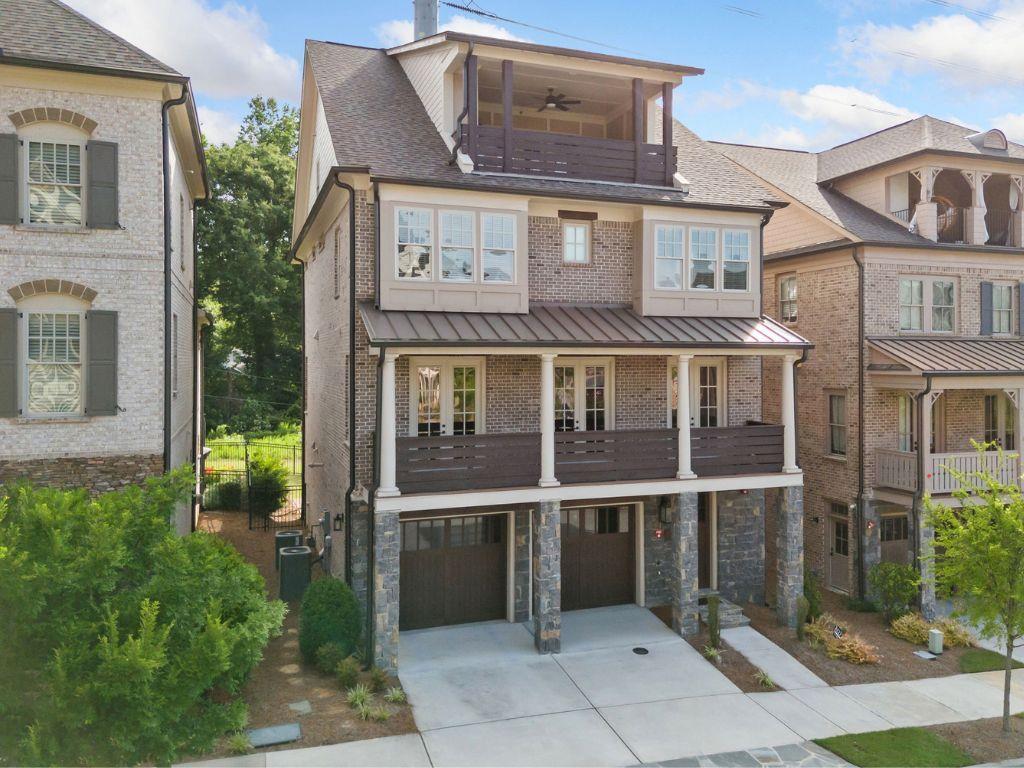 Step into luxury living just minutes from downtown Atlanta and Buckhead in this beautifully crafted 5-bedroom, 5.5-bath single-family home located in the exclusive Enclave on Collier. This boutique John Wieland collection offers a gated, serene community filled with upscale amenities and timeless design.
As you enter the home, you’re greeted by an elegant foyer and easy access to the terrace level, where you’ll find a bedroom with an ensuite bath, a kitchenette, and access to the covered patio and fenced backyard, perfect for guests, a private office, or multigenerational living. There is also a mudroom, and the garage is thoughtfully outfitted with a slat wall, extra shelving, and built-in storage to keep everything organized.
Take the elevator (servicing ALL floors) or stairs to the main living level, where you’ll find two spacious living rooms, one featuring built-in bookshelves flanking a cozy fireplace. The chef’s kitchen is a showstopper with top-of-the-line stainless steel appliances, including a 6-burner Thermador range and microwave drawer, quartz countertops, an oversized island open to the keeping room and breakfast area, and a walk-in pantry with its custom wine rack. Also on this level: a guest bedroom, full hall bath, and a formal dining room/library that opens via three French doors to the full-length front porch overlooking an acre of greenspace.
The owner’s suite on the third floor includes a spa-like bathroom with a freestanding tub, dual vanities, two private water closets, and two custom closets with dressing areas. Two additional bedrooms complete this floor, each with an ensuite bath and a convenient laundry room. The fourth level offers a large media room with built-in speakers, tech closet, wine fridge, guest suite with full bath, and access to a sky terrace with fireplace, perfect for entertaining.
Community amenities include gated entrances, a one-acre central park with a gathering pavilion and fireplace, and a neighborhood dog park. Located less than a mile from shopping and dining, Bitsy Grant Tennis Center, Bobby Jones Golf Course, the Atlanta BeltLine Northside Trail, and Atlanta Memorial Park.