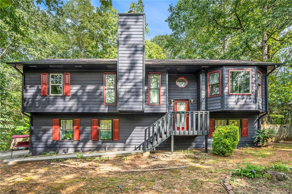 Spacious 4-bedroom, 3-bathroom home with a finished in-law suite and two full kitchens. The main level features an updated kitchen with modern finishes, a primary suite with bay window, walk-in closet, and en suite bath with double vanities and garden tub.
The lower level offers a private in-law suite with oversized bedroom, full bath, living/dining area, and kitchen with butcher block countertops—perfect for extended family or guests. Enjoy plenty of storage, a large laundry room, and an expansive deck overlooking the wooded backyard, ideal for entertaining.
