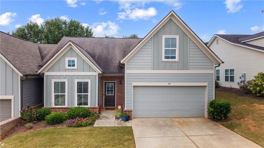 Gracious southern living meets the easy, low maintenance of a townhome. Northside Commons is a wonderful, gated, swim & tennis community just a stone's throw away from downtown Winder. Offered here is a premium corner unit home that's been lovingly maintained by only one owner so far. Get ready to call this special place your own! What an amazing floor plan with two full bedrooms and two full bathrooms on the main (including the master suite). Open concept living and dining gives you several fun ways to entertain especially around the beautiful kitchen island. Inside the owner's suite there are vaulted ceilings in the bathroom as well as a massive walk-in closet. Impeccably maintained and gently lived in - we have also just added brand new vinyl flooring. The back patio is comfortable and inviting...The perfect place for morning coffee or an evening cocktail. In total, three full bedrooms and three full bathrooms. The home has a large two-car garage. Sidewalks line every street in the neighborhood and there's also a serene walking trail. Convenience meets comfort as you are right next door to the brand new Publix shopping center, a hospital, Fort Yargo State Park, Downtown Winder, and endless possibilities for shopping, dining, and recreation. Come and stay awhile! We know you'll absolutely love this home.