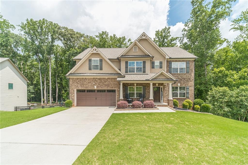 Welcome to 545 Jefferson Blvd in the sought-after Jefferson City School district! This home features 6 bedrooms 4 full baths with classic crows feet on the front elevation, cedar shake and brick front and a 30 year architectural shingle roof. Covered front porch and covered back deck overlooking a private backyard with a creek. Step inside the foyer where hand-scaped hardwood flooring leads into beautiful dining room with coffered ceilings, brushed nickle lighting, and large windows with 2-inch faux blinds throughout. The family room boasts a stone fireplace with a cedar mantle. The chefs kitchen features gorgeous white cabinets, upgraded crown molding, granite counter tops, tiled backsplash, stainless steel appliances, recessed lighting, kitchen island overlooking livingroom. Hardwood staircase with wrought iron spindles leads to an upstairs media or family room. Oversized owners' suite with triple tray ceiling, sitting area, spa-like bathroom featuring tiled flooring and oversized tiled shower. The secondary bathrooms are upgraded with granite counterops. Basement features its own living room, office area, kitchenette and secondary laundry room. This swim/tennis community has it all!