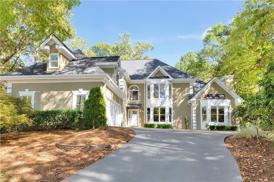 Elegance and comfort meet in this stunning renovated home with a finished basement, designed to welcome you with warmth, sophistication, and abundant natural light. Offering 5 bedrooms and 4.5 baths, the main level features a serene owner’s suite with hardwood floors, a cozy fireplace, custom closet, and chic barn door. The chef’s kitchen is a true showpiece, complete with custom white soft-close cabinetry, a dramatic country-style island, white quartz countertops, block tile backsplash, in-cabinet wine cooler, stainless steel appliances, and abundant storage. Flowing seamlessly from the kitchen is a formal dining room that comfortably seats up to 12 — perfect for hosting memorable gatherings. The spacious family room features custom built-ins and a welcoming fireplace, while a den/office off the foyer offers additional functional elegance. Sunlight pours through the home’s many windows, creating an inviting, airy feel that enhances every space. Custom lighting and gleaming hardwood floors throughout the main level add to the home’s refined charm.
Upstairs, four generous bedrooms, two full baths, a bonus room above the garage, and a conveniently located laundry room provide ample space for family and guests. Custom wood and wrought iron railings add a touch of timeless beauty. The finished basement offers exceptional versatility, featuring a custom theater room with bar (convertible to a bedroom), a large game room with brick fireplace, exercise gym, office, full bath, and abundant storage. The entire home enjoys the convenience of a whole-house water filtration system. Outside, experience true luxury entertaining with custom exterior lighting, a stone walkway leading to a stone patio, a fully fenced landscaped backyard, shed, and double decks spanning the full length of the home. Nestled in a desirable community, this exquisite home is just minutes from Dunwoody Village and top-rated schools — a bright, beautifully designed retreat where every detail has been thoughtfully crafted for comfort and style.
