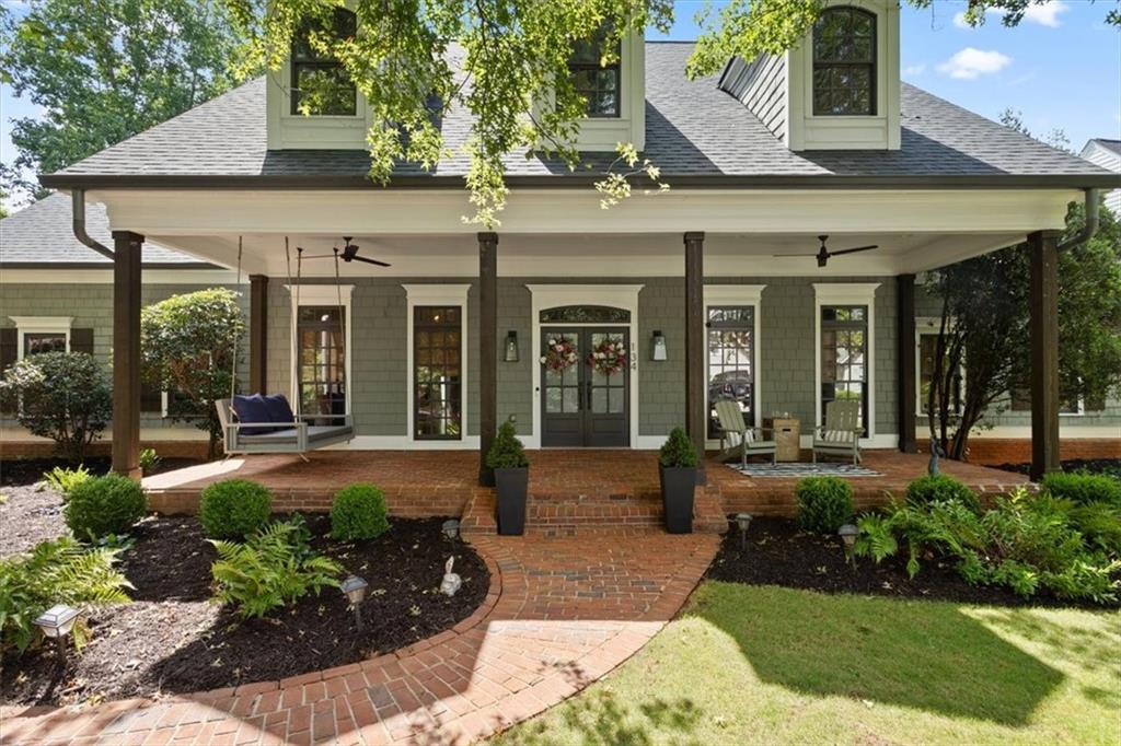 Discover your next luxurious residence, now available in the prestigious gated community of Achasta, perfectly nestled in the picturesque foothills of Dahlonega's majestic mountains! This impeccably renovated 5-bedroom, 4-full and 2-half bath Craftsman home defines sophisticated mountain living with unparalleled upgrades and refined finishes throughout.
The grand main level features a spacious primary retreat with a spa-inspired bath, custom-designed closets, and private access to a covered patio overlooking serene wooded hillsides with incredible views from morning to night.
The vaulted great room, anchored by a gas fireplace, flows into a renovated gourmet eat-in kitchen that seats eight, outfitted with granite countertops, premium stainless steel appliances including a double oven and separate gas cooktop and an adjacent formal dining room to host unforgettable dinner parties and lively celebrations.
The main level also includes a large private office with French doors, while the main-level deck invites outdoor grilling and relaxation. Additional conveniences include a main-level laundry with a wash basin, a stylish half bath, and multiple pantries for storage.
Upstairs, three generously sized bedrooms provide ample space for family and guests. One bedroom features a luxurious en-suite bath, while the other two share a well-appointed Jack-and-Jill bathroom. Included on the upper level is a versatile loft area perfect for a playroom, and access to unfinished attic space, which offers endless possibilities for customization.
The expansive terrace level has been elegantly renovated and designed for multi-generational living or guest accommodations. It boasts a second gourmet kitchen featuring soft-close cabinetry, a spacious island with storage, granite countertops, and high-end stainless steel appliances, including a large gas range and oven. Enjoy a home gym, a custom bunkroom with built-in storage, a cozy den with a gas log fireplace, and a state-of-the-art Sonos home theater system paired with a 75-inch TV. This renovated level also features a spacious bedroom with an ensuite bath, walk-in closet, and abundant storage, complemented by a convenient washer/dryer setup and a mudroom with private entryway.
Embrace year-round outdoor living on multiple decks and patios, each offering tranquil views of the lush wooded hillside. As a resident of Achasta, indulge in amenities including a Jack Nicklaus signature golf course, an elegant clubhouse with dining, tennis and pickleball courts, pool, and scenic nature trails winding through the neighborhood and along the Chestatee River.
Enjoy unparalleled convenience just minutes from GA 400, the new Publix, the state-of-the-art hospital, the University of North Georgia, and the vibrant downtown Dahlonega.