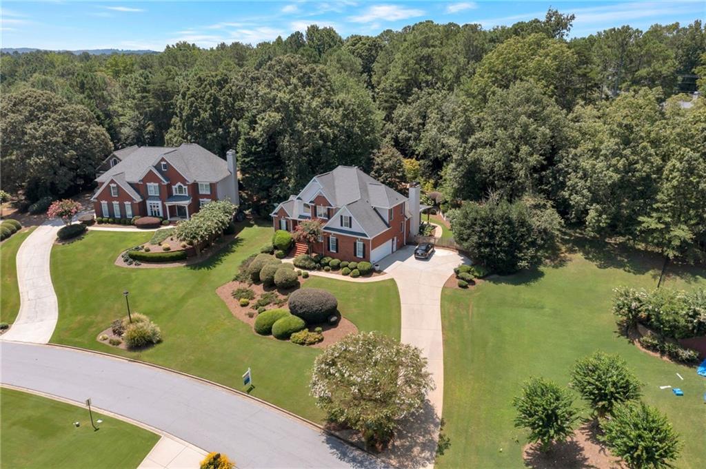 Fantastic opportunity to own a 4-sides brick, 5-bedroom, 4.5-bath home with a full basement in a sought-after 55-acre lake community!
The impressive 2-story foyer with hardwood floors opens to a formal dining room, also with hardwoods. The soaring 2-story great room features a cozy fireplace and custom windows overlooking the private backyard. The vaulted gourmet kitchen is a chef’s delight with granite countertops, high-end stainless steel appliances, a breakfast bar, and a sunny breakfast nook. The adjoining vaulted keeping room offers a second fireplace.
The main-level primary suite boasts a tray ceiling, a wall of windows, and a large walk-in closet with built-ins. The spa-like primary bath includes dual vanities, a tile shower, and a jetted tub. Upstairs you’ll find three spacious bedrooms and two additional full baths.
The finished terrace level offers a 5th bedroom and full bath, a large rec room with a wet bar, and ample unfinished storage space.
Step outside to your own backyard paradise featuring a covered patio, expanded firepit area, a tranquil waterfall and koi pond, and professionally landscaped gardens.
Located in a vibrant lake community with swimming pools, tennis courts, a party pavilion, playground, and community dock. This home is a true must-see!