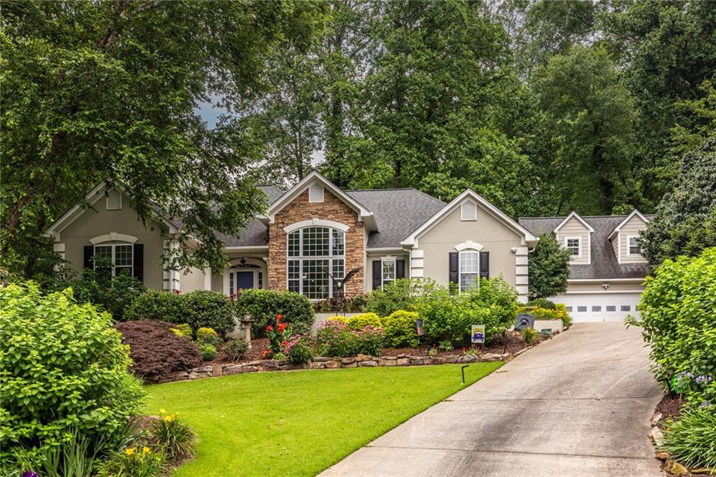A beautiful mediterranean ranch which was custom built by the owner and lovingly maintained over the years in the sought after Historic College Park area near the Woodward Academy Campus. The grounds are park like and that is no exaggeration at all. The plantings and the Koi pond are very tastefully done. As you enter the home the finishes are definitely well thought out by the owner and his designer. On the main floor you have a foyer, light filled Living room with Stone fireplace, formal dining room, Chef's kitchen w/informal eating area as well as a breakfast bar, laundry room, and the expansive master suite. The master bath is a true delight with a double bowl vanity, soaking tub and separate shower. The closet is a walk in with ample hanging and storage space. also on the main floor we have two guest bedrooms with an adjoining full bath. The full basement is 80% complete with a fourth bedroom, third full bath, game room and family room. Plus there's unfinished storage area. One of my favorite features is the screened porch off the kitchen which is a terrific spot to enjoy that morning coffee or the company of good friends. The two car garage is a stand alone with a large bonus area above the parking. Come see this one, you definitely will not be disappointed.